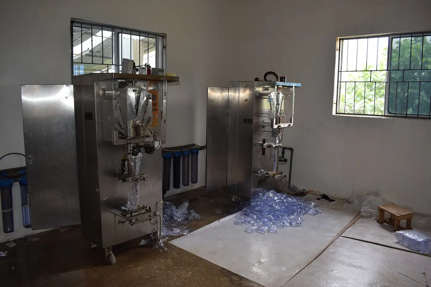 Automatic sachet water packing machines in a Nigerian water factory